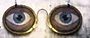 Close-up of two glass eyes in spectacles