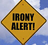 a street sign thats says, "Irony Alert"