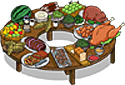 various kinds of meats, fruit, and vegetables arranged on a lazy susan