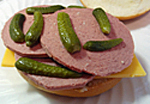 image of a liverwurst sandwich with pickles