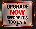 a sign that reads "Upgrade Now Before It's Too Late"