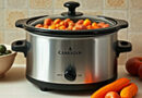 a crock pot filled with diced carrots