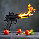 a gun firing and some veggies on the table beneath it