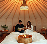 a couple reading in a luxurious bed in a glamping yurt