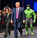 President Trump being escorted on stage by Kid Rock and the Hulk