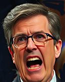 A baby curiously touching a man's face while he lies on grass.