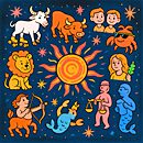 A baby curiously touching a man's face while he lies on grass.