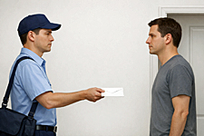 A postal worker with the recipient’s identical face delivers a blank envelope—visualizing the new class of mail: Unsent Letters.