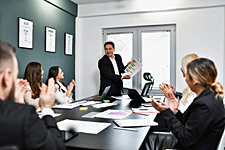 Illustration of  people demonstrating a “courtesy clap” with palms parallel and wrists neutral, illustrating HOA-approved clapping technique for residents